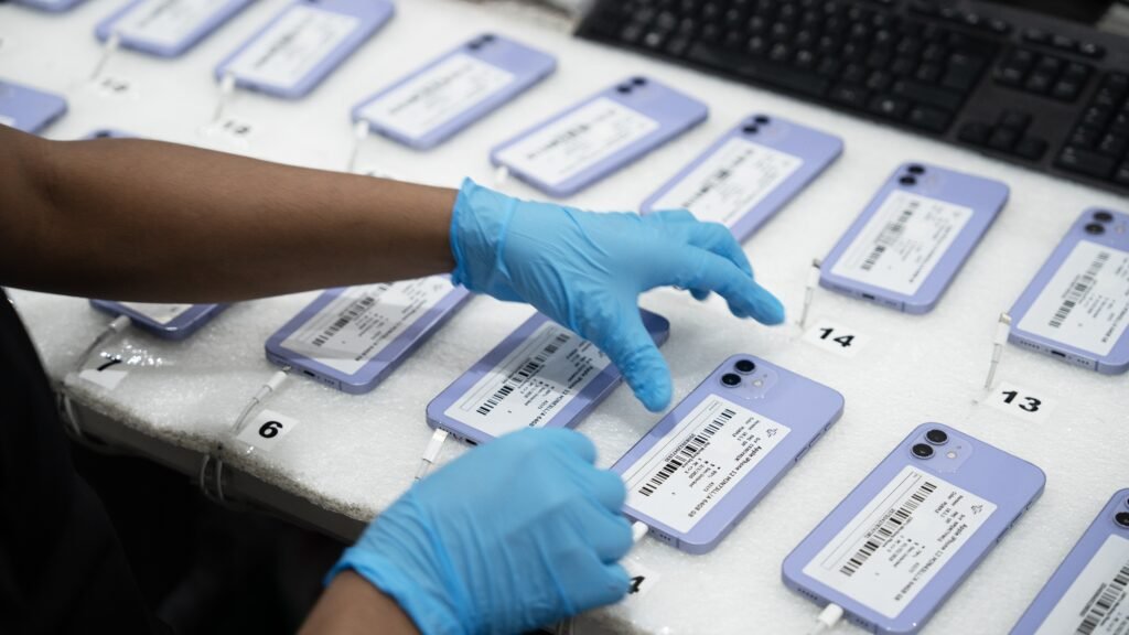 Used iPhones being tested and graded before wholesale distribution.